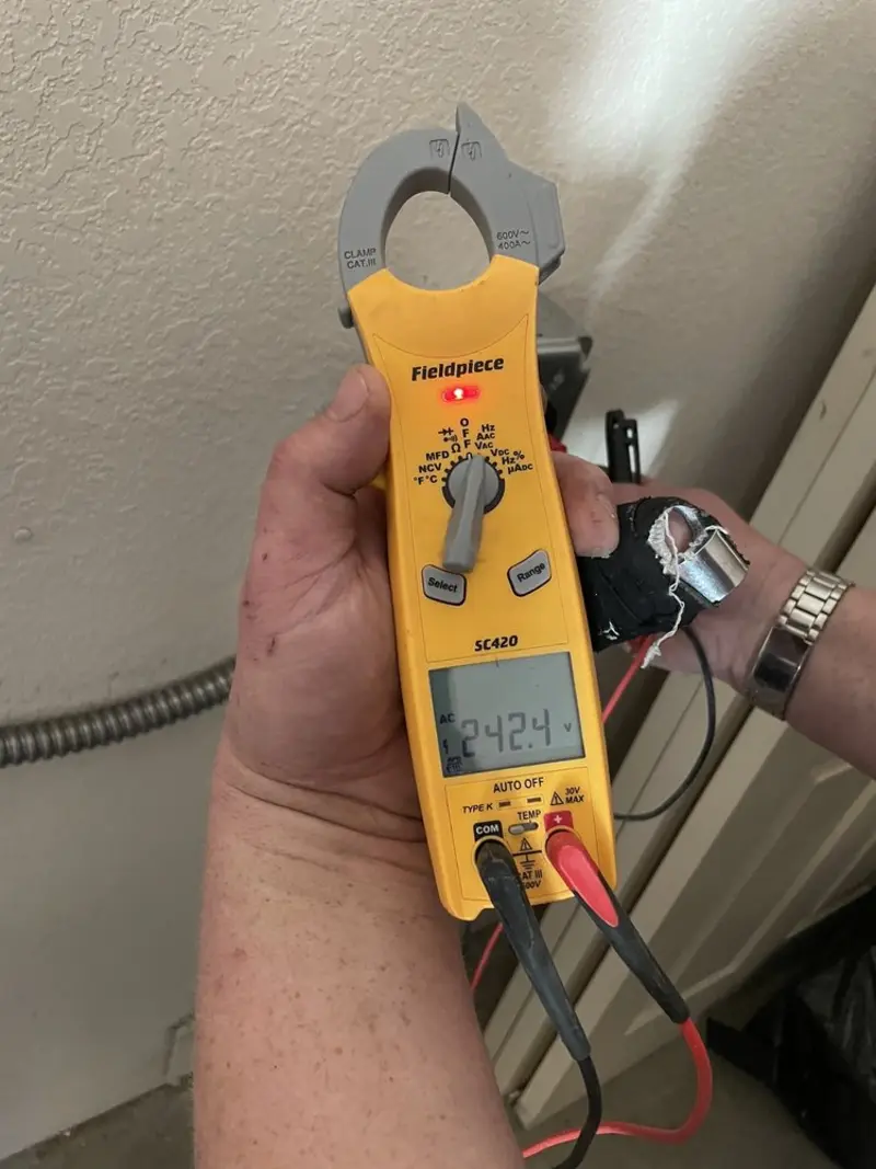 Voltage testing with clamp meter during Ceiling Fan Installation in Greenwood